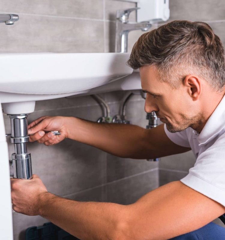 adult-plumber-fixing-sink-at-bathroom-2022-12-16-21-18-13-utc